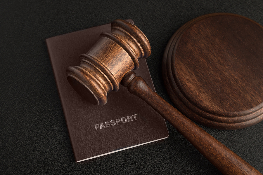 Passport and a gavel. Immigration Law concept