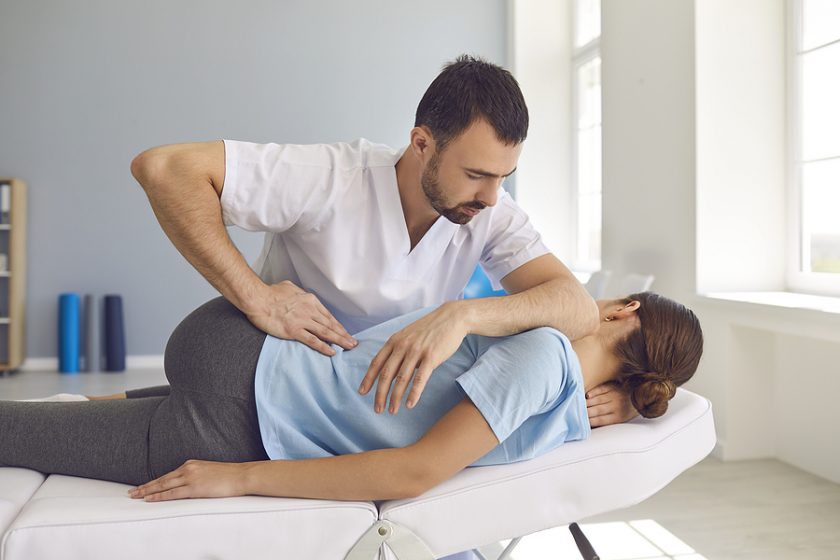 Woman getting treatment inside a chiropractic clinic